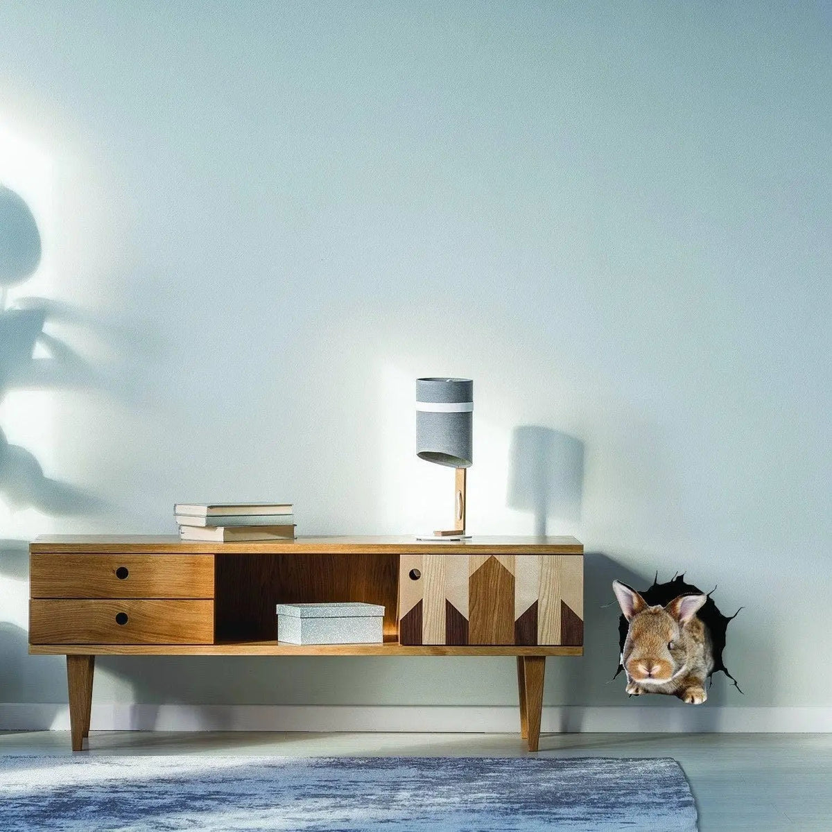 Rabbit wall decal peeking through a printed wall opening