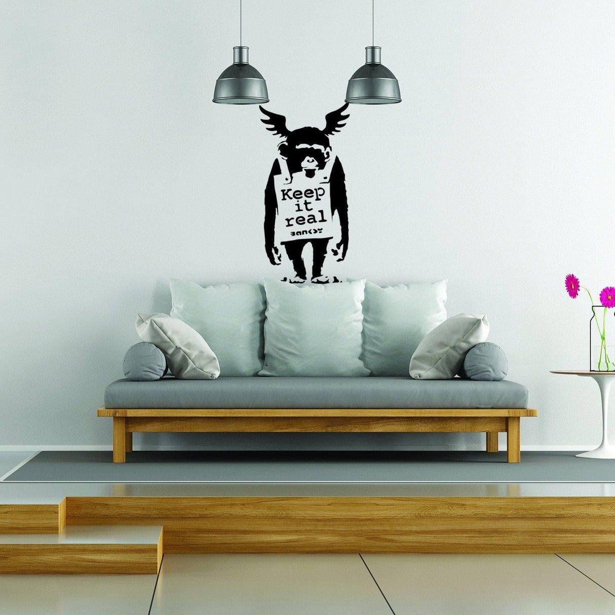 Monkey graffiti wall sticker with Keep It Real text displayed on a modern wall.