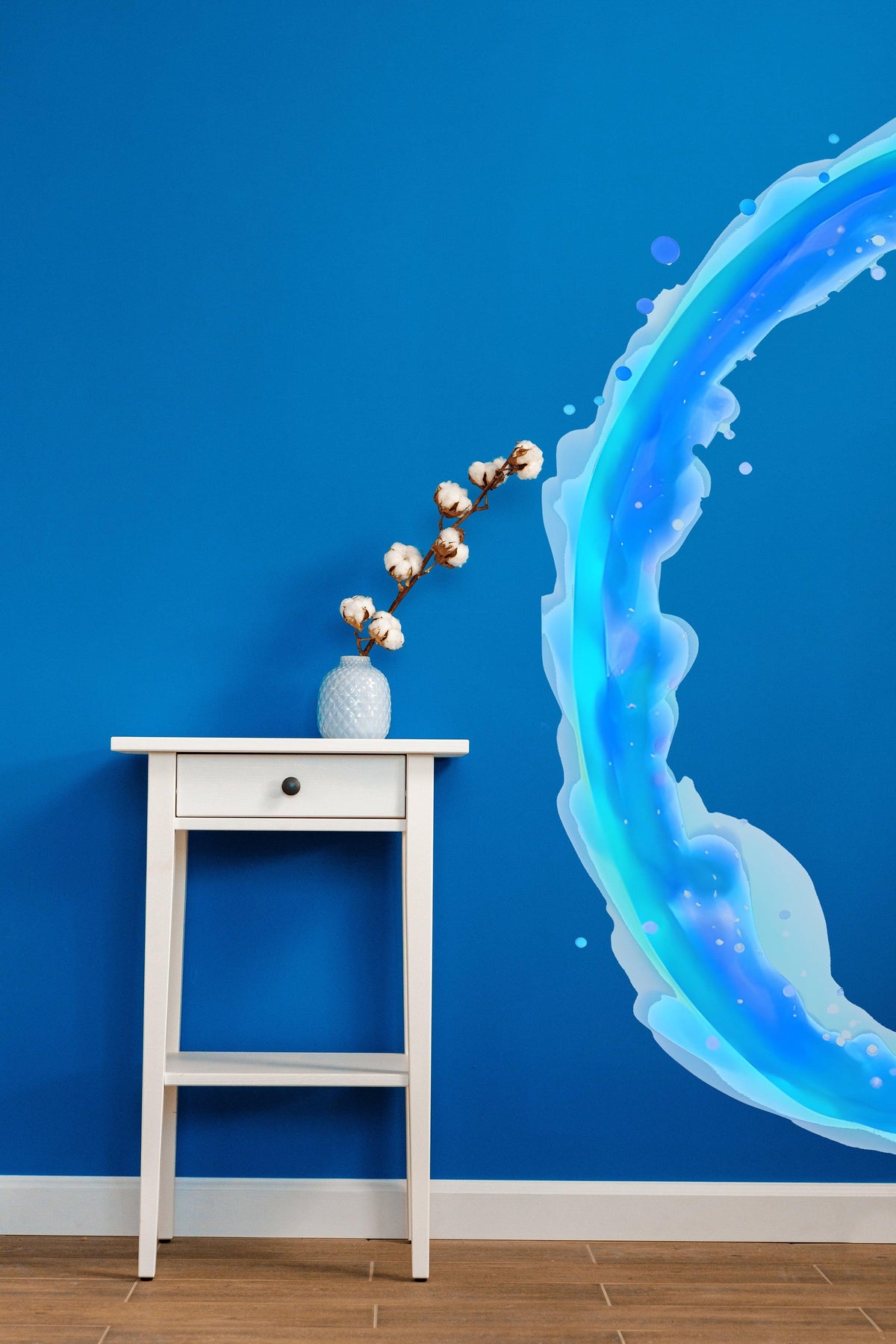 Blue and orange portal aura wall sticker on a blue wall beside a white side table with a vase.
