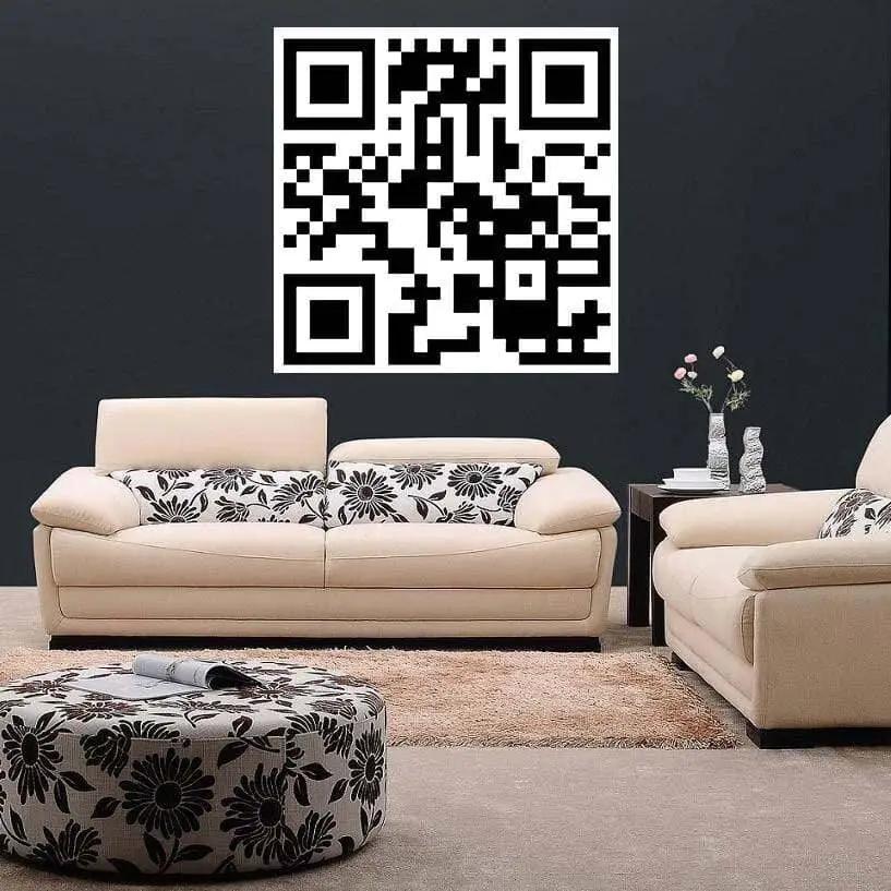 Custom QR code decal on wall above stylish white sofas in modern living room.
