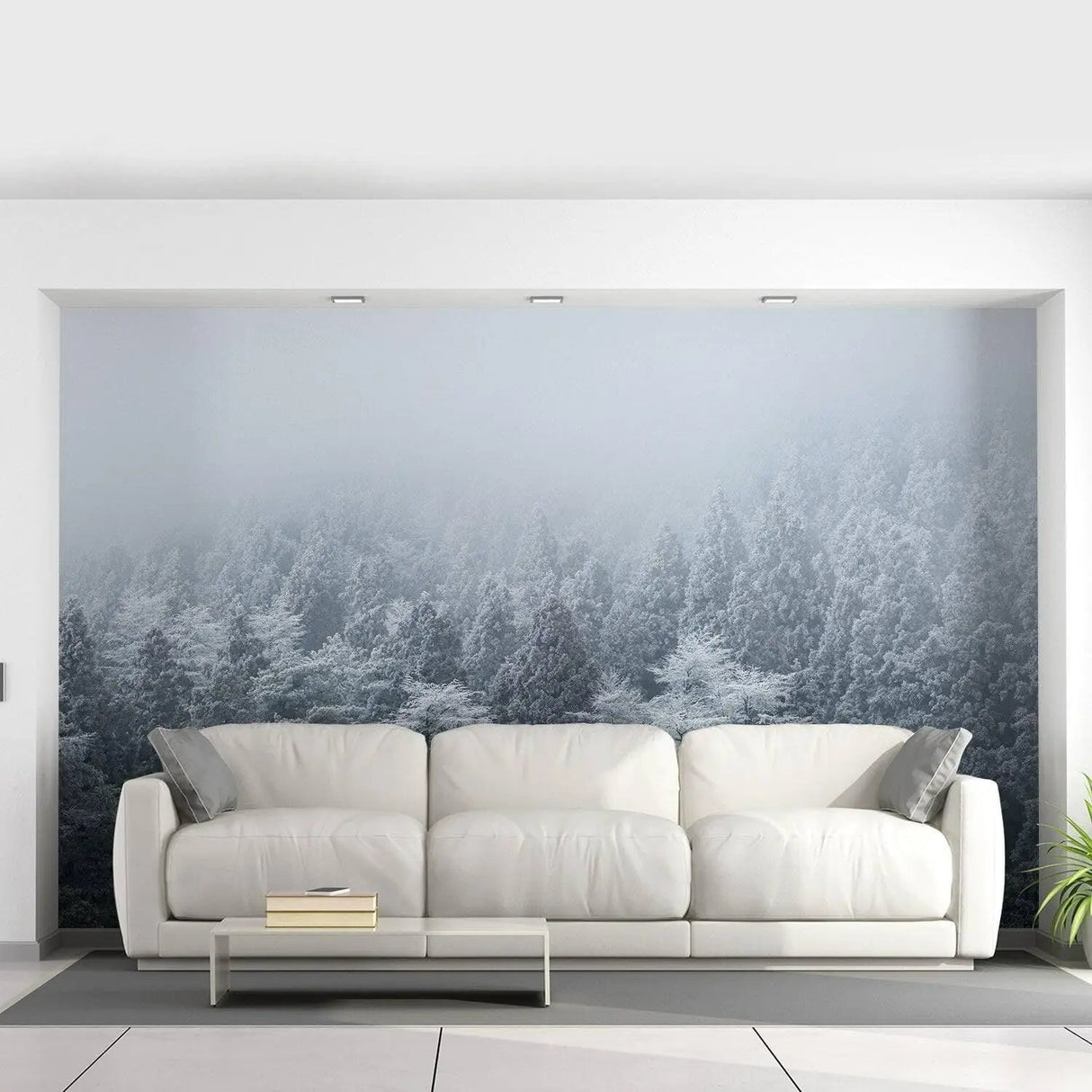 Misty Pine Hill wall mural creating a serene forest ambiance behind a modern white couch in a stylish living room.