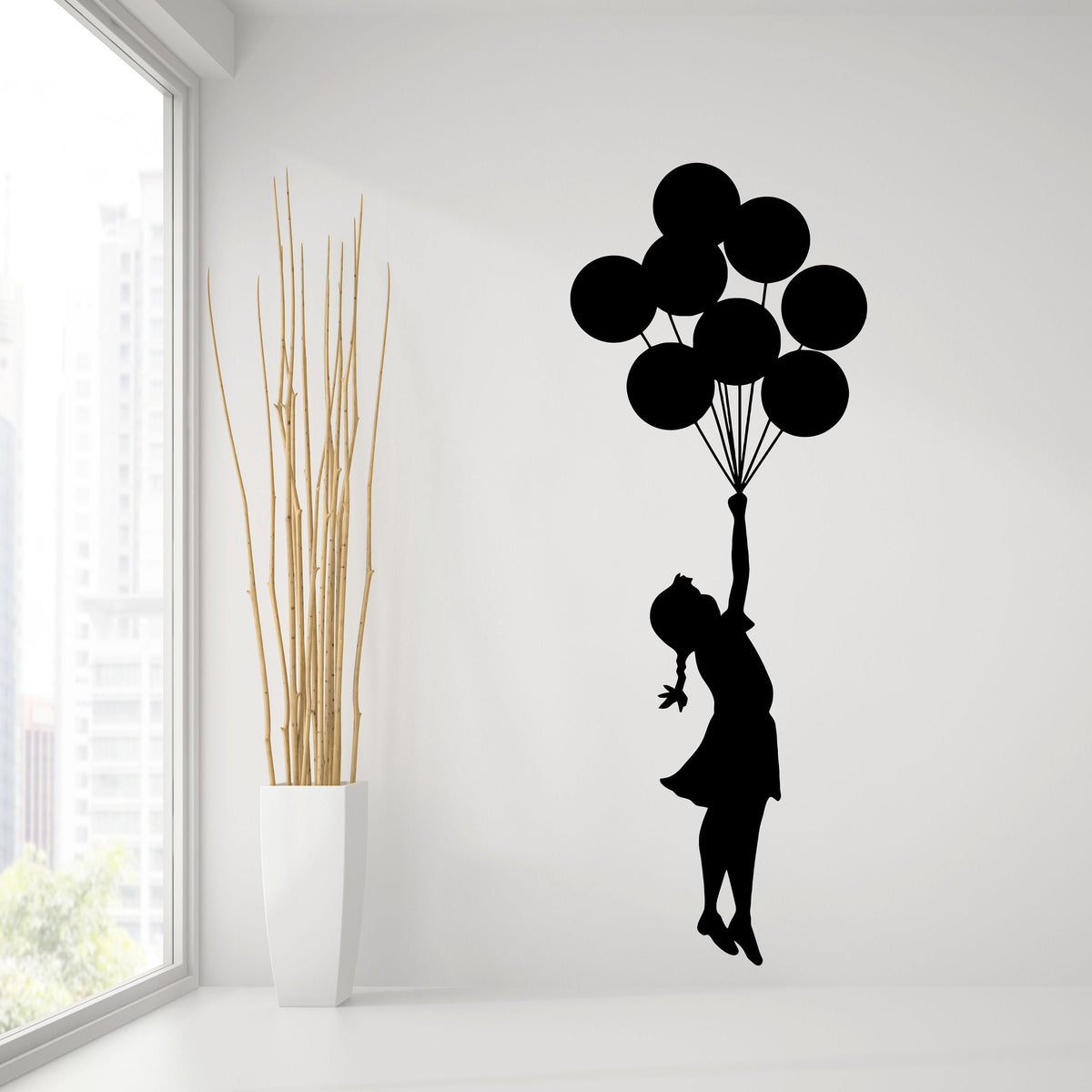 Girl with balloons street art vinyl wall decal.