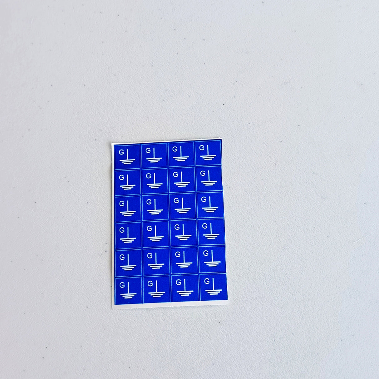 Additional product view of Blue Grounding Symbol Stickers.