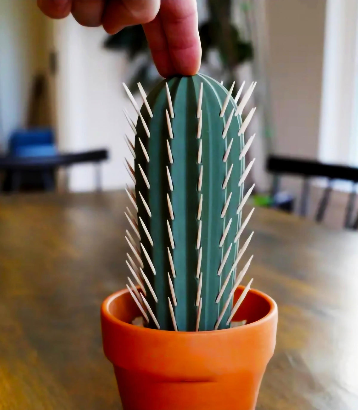 3D printed cactus toothpick holder with toothpicks resembling cactus spines.