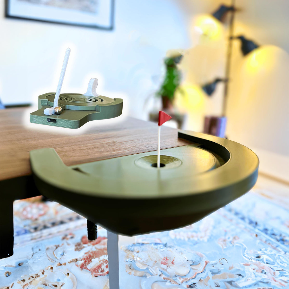 Desktop golf game featuring mini putting green with flag and ball return.