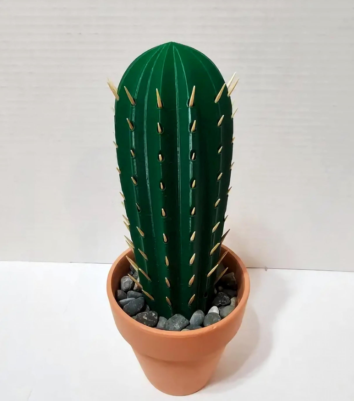 3D printed cactus toothpick holder with toothpicks as spines in a terra cotta pot.