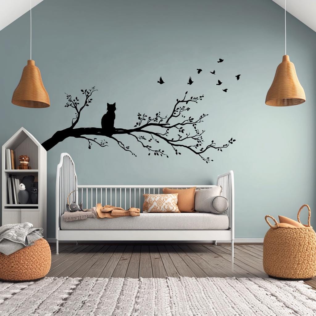Vinyl wall decal of a cat sitting on a tree branch with flying birds.