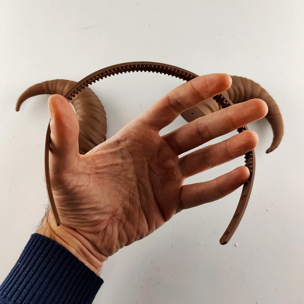 Product detail view of 3D Printed Curved Ram Horns Headband.