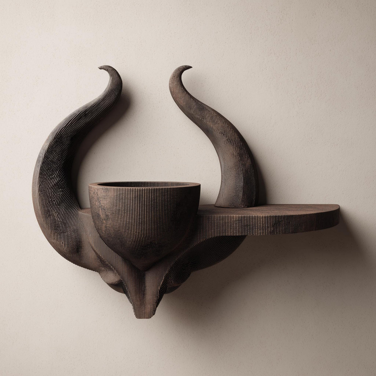 3D printed matte PLA wall shelf with a horned skull-like base.