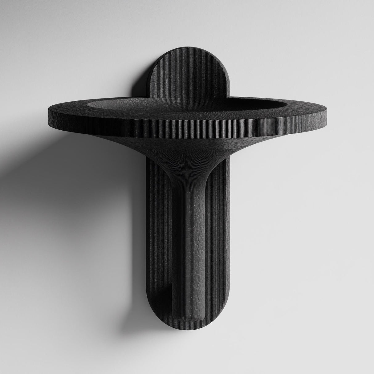 3D printed wall mounted bowl shelf with a wide round tray and sculptural vertical support and visible print texture.