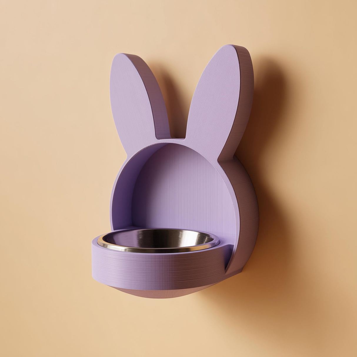 3D printed bunny-shaped wall mounted pet bowl holder with long ears and a round bowl opening.