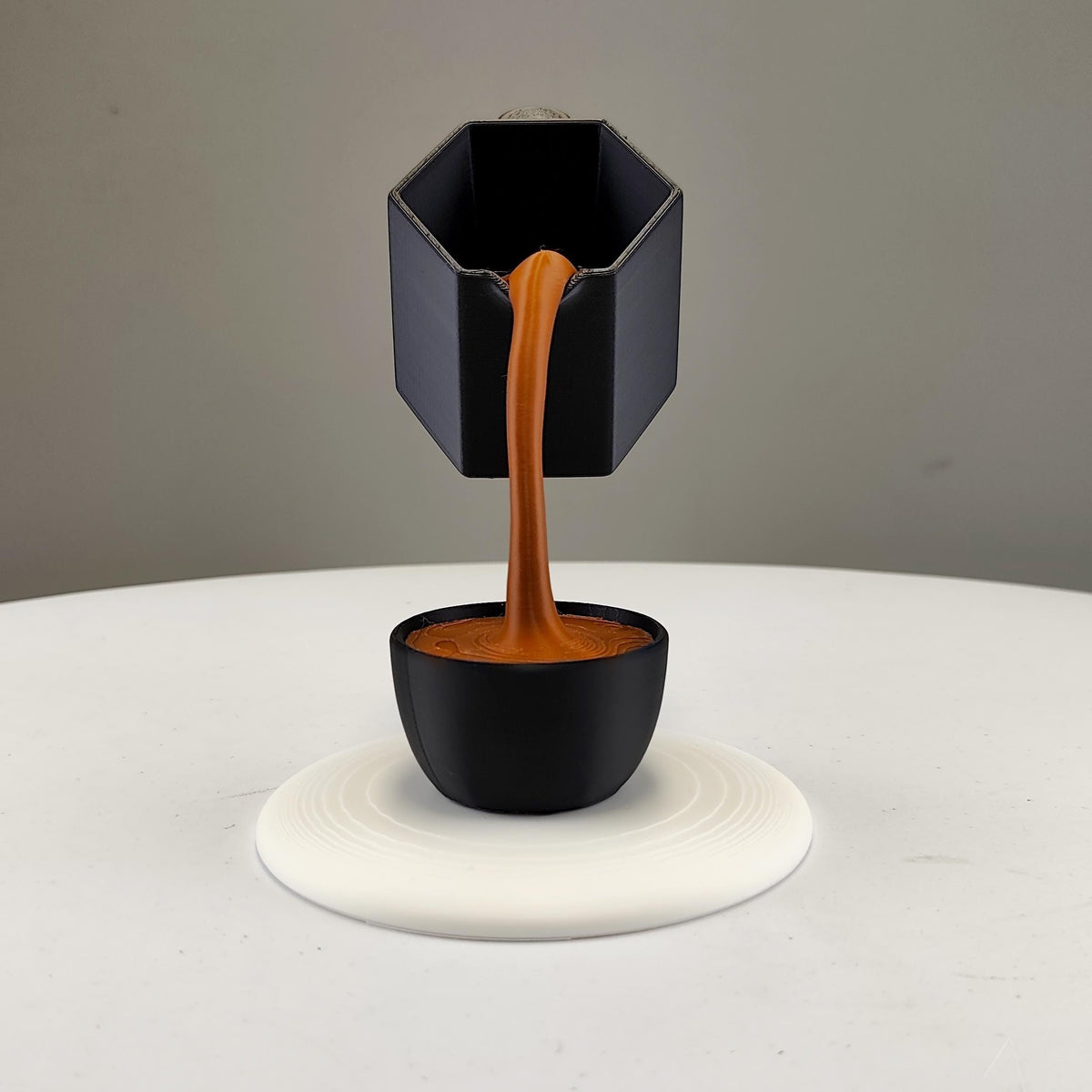 Additional product presentation of Floating Coffee Pour Sculpture.