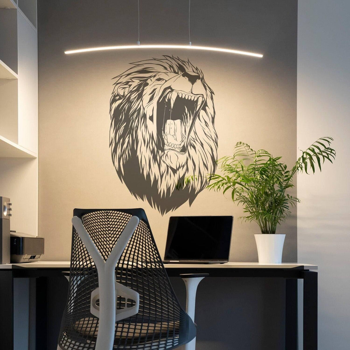 Roaring lion head wall decal displayed in a modern workspace.