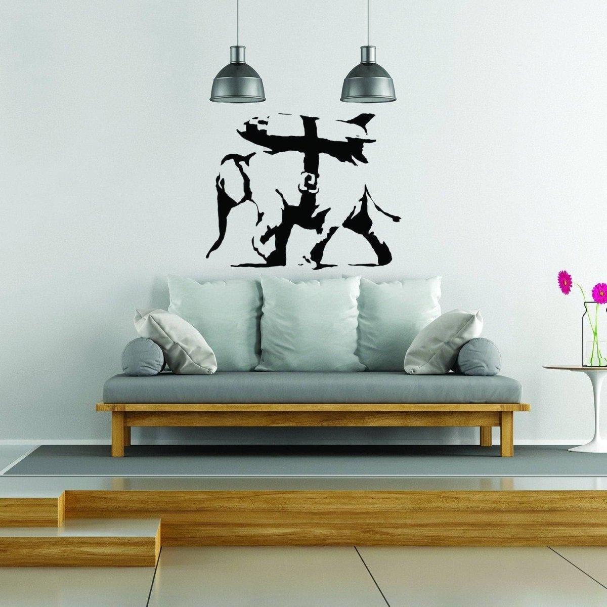 Graffiti-style elephant wall decal displayed above a stylish couch.