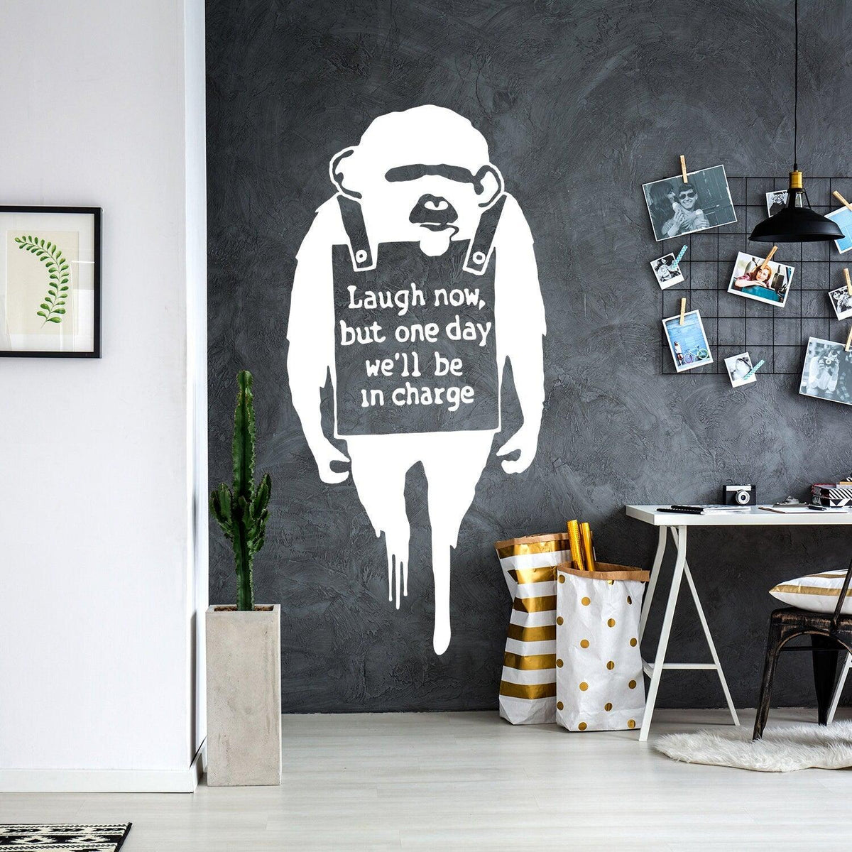 Laugh Now monkey wall sticker displayed in a modern living room.