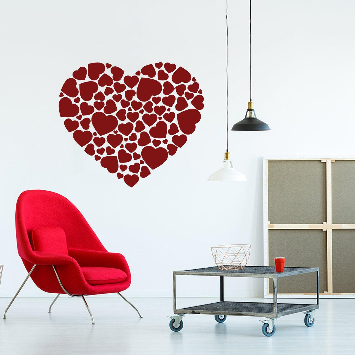 Decorative heart wall decal made of small red hearts in a contemporary living room setting.