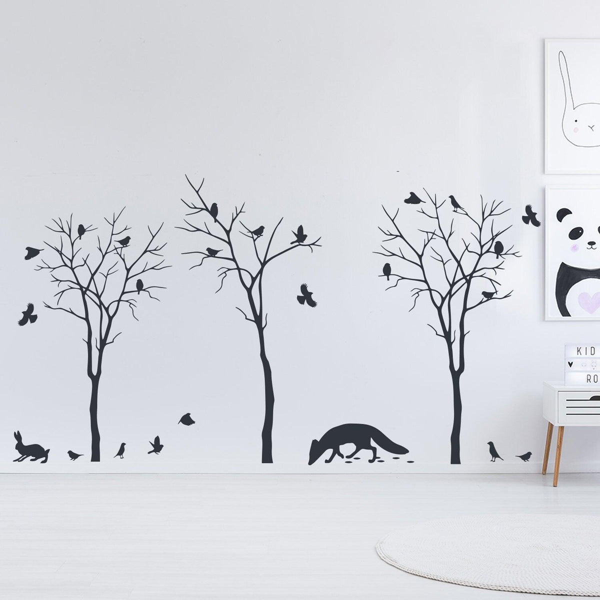 Stylish wall decal featuring black trees, birds, and a fox.