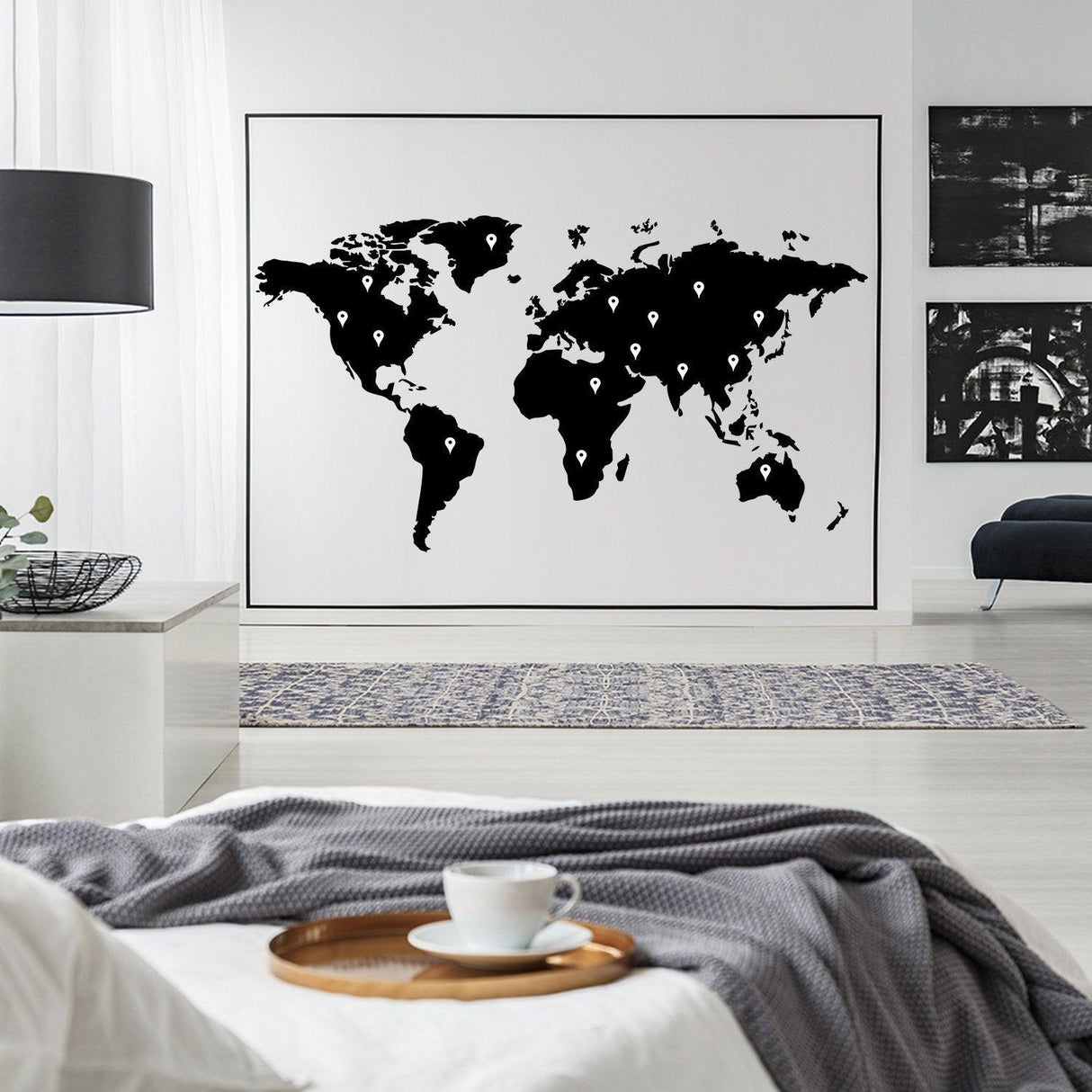 World map vinyl sticker wall art in a modern living room, adding unique decor and personality to the space.