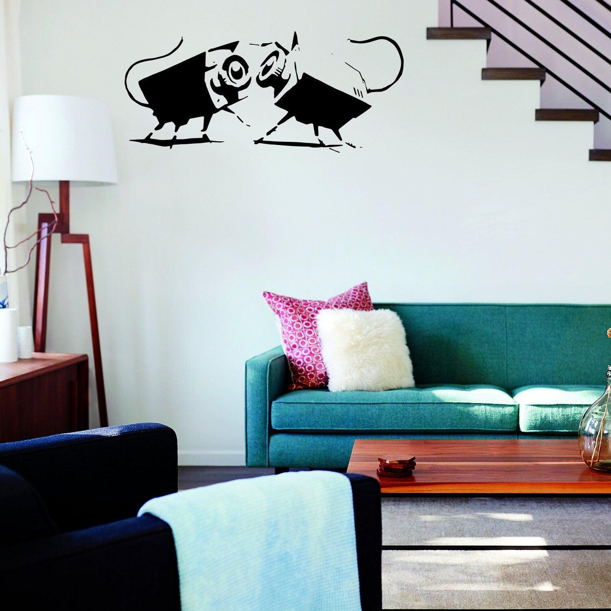 CCTV street art vinyl sticker displayed above a green sofa.