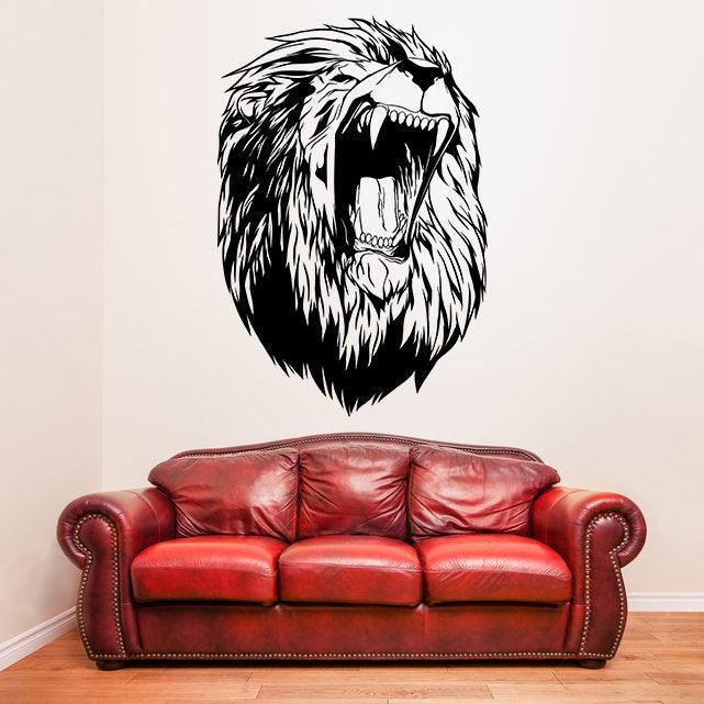 Large lion head wall decal above a red couch, adding a wild aesthetic to living room decor.