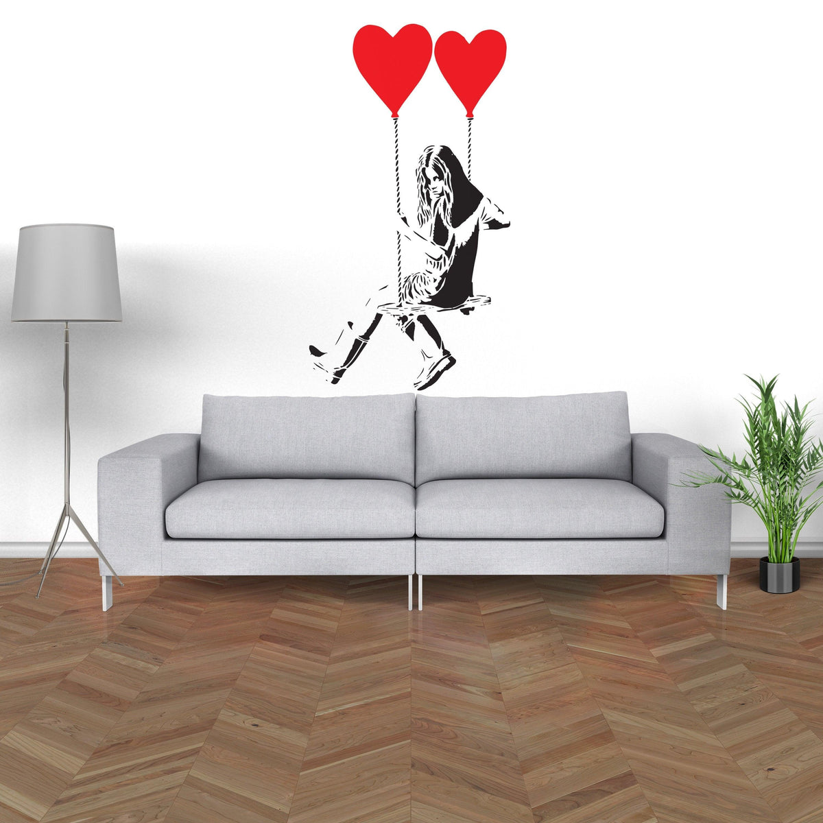 Girl with heart balloon wall sticker above a modern couch.