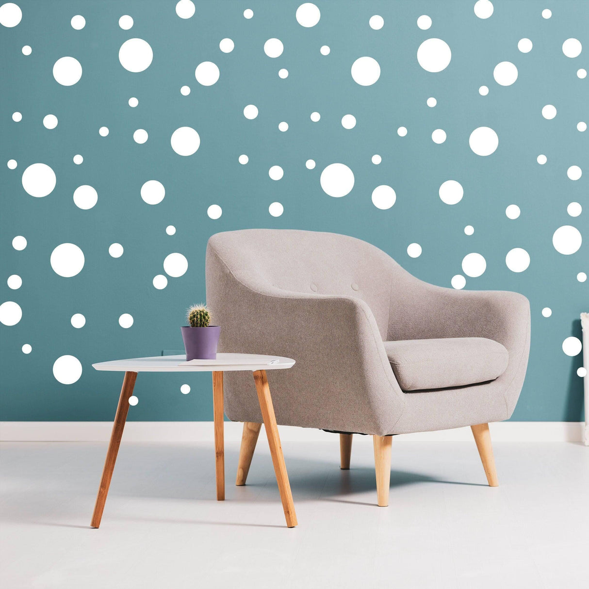 Cozy living space featuring white round dot stickers on a blue wall, enhancing creativity and decor style.