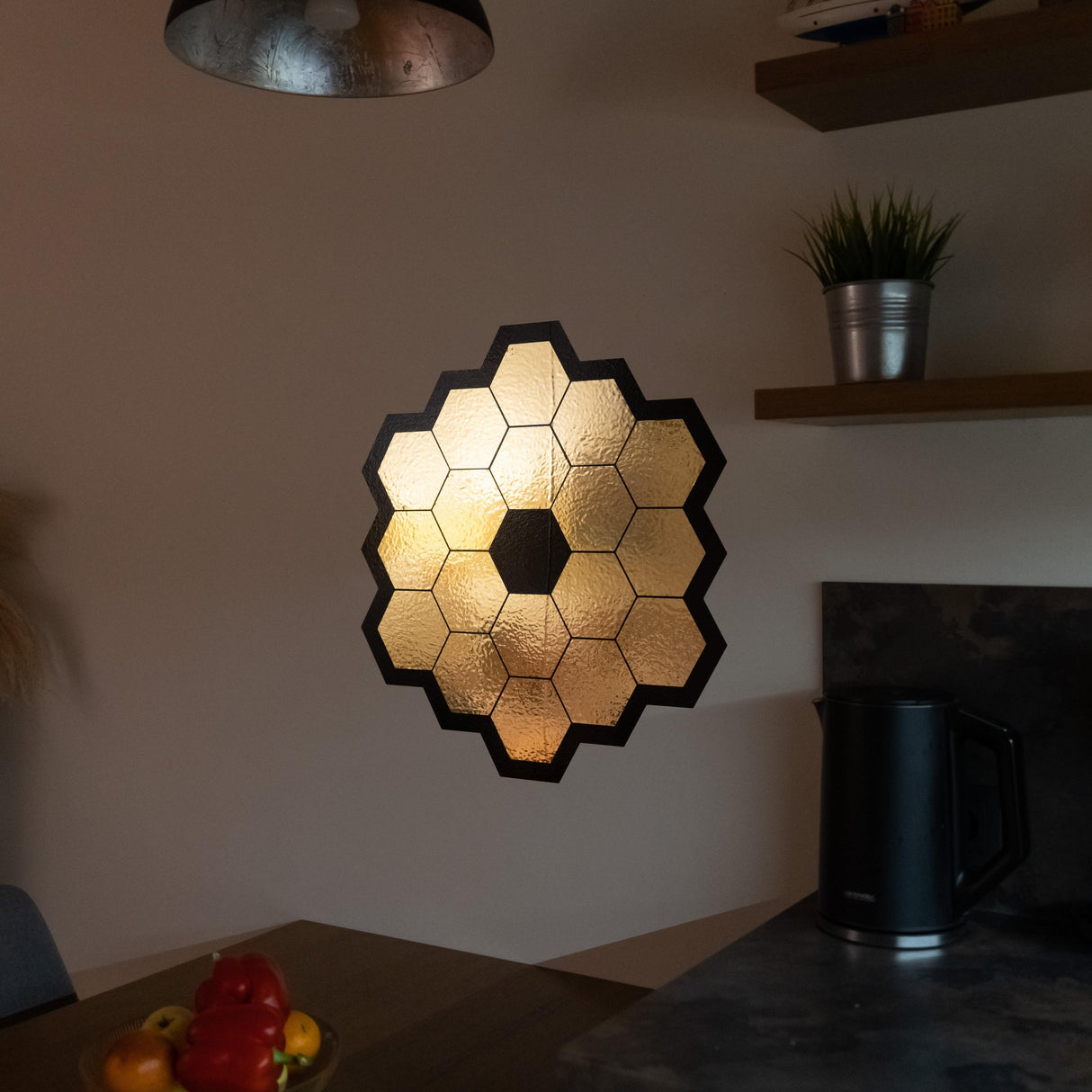 Gold chrome vinyl wall sticker of James Webb Space Telescope mirrors.