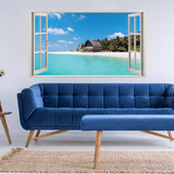 3D beach view wall decal showing a tranquil tropical paradise through open windows in a modern living room.