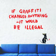 Artistic urban vinyl wall decal featuring graffiti text and rat design on a white brick wall above a blue sofa.