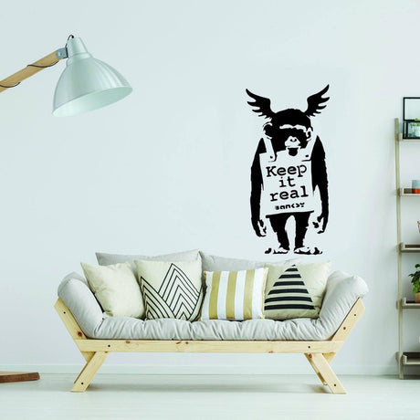 Monkey graffiti wall decal displayed above a modern sofa.