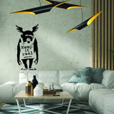 Monkey graffiti wall sticker with Keep It Real text in a modern living room.