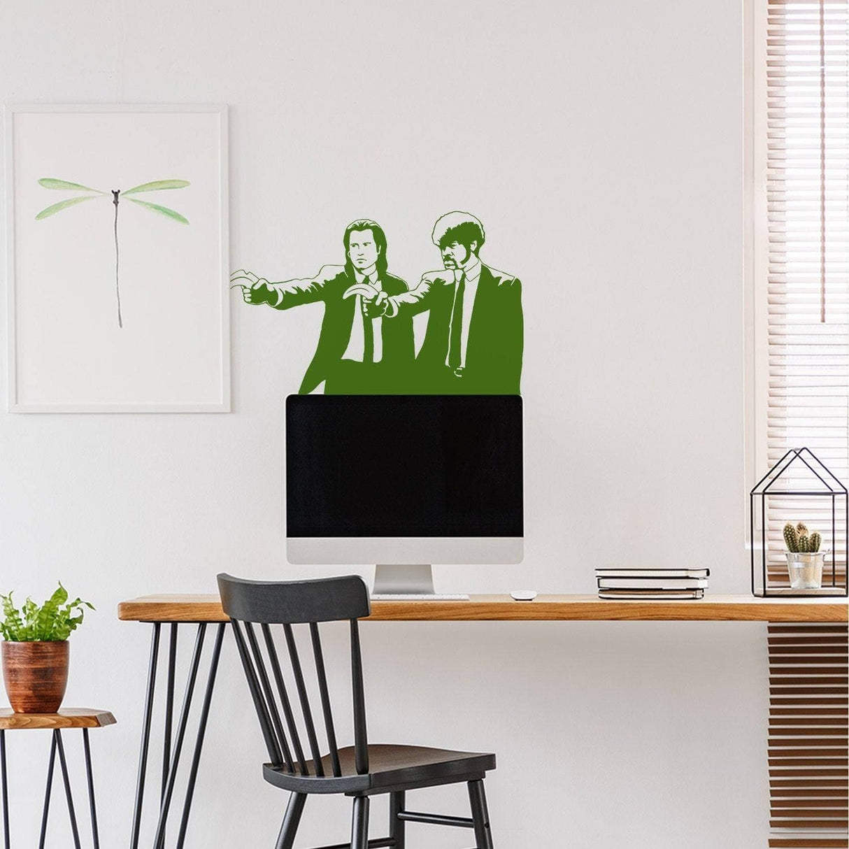 Green retro movie duo wall sticker displayed in a modern workspace.