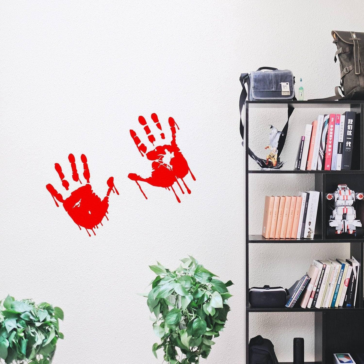 Spooky red handprint vinyl decal on a wall.