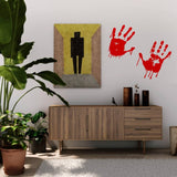 Spooky red handprint vinyl decals on wall near a modern wooden cabinet and potted plant.