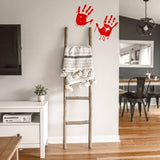 Spooky red handprint vinyl decal on a wall above a wooden ladder with a blanket.