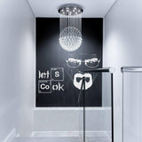 Let's Cook quote wall sticker displayed on a modern kitchen wall.