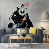 Whimsical black cat wall decal with colorful headphones in modern living room setting.