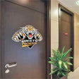 Custom tiger emblem vinyl decal displayed on an office door.