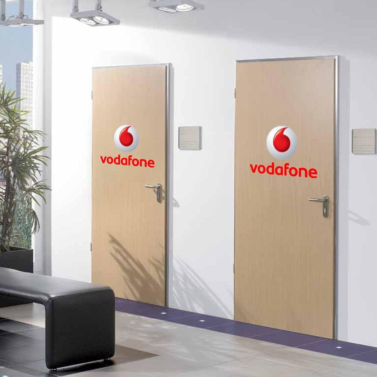 Two office doors featuring custom circular logo decals.
