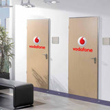 Two office doors featuring custom circular logo decals.