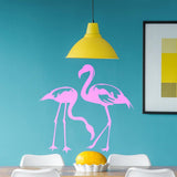 Flamingo wall decal featuring two pink flamingos on a blue wall, adding tropical charm to home decor.