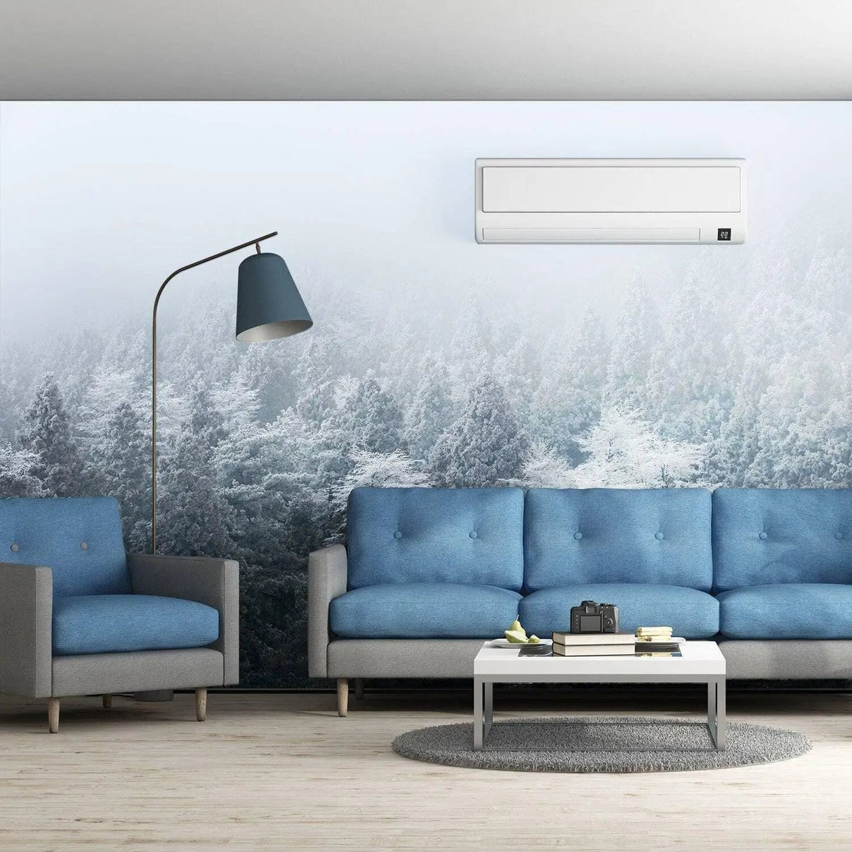 Misty pine hill wall mural creating a serene ambiance in a modern living room with blue sofas and stylish decor.