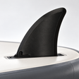 Illustrative view of a black Hydro Force compatible replacement fin mounted on an inverted SUP board