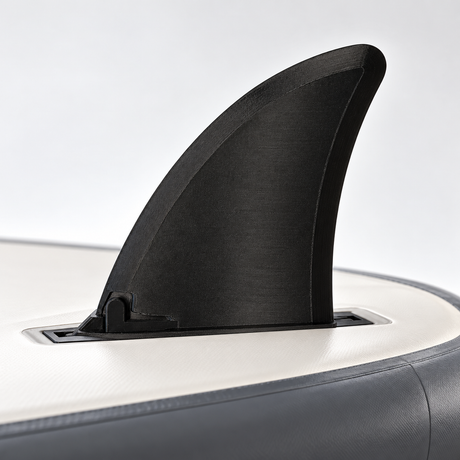 Illustrative view of a black Hydro Force compatible replacement fin mounted on an inverted SUP board