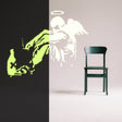 Glow-in-the-dark fallen angel wings wall decal with a street art design.