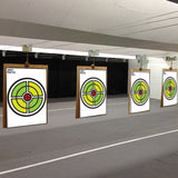 Concentric ring scoring target poster shown in a practice setting.