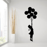 Girl with balloons street art vinyl wall decal.