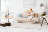 Round sun wall decal with mountain landscape design.