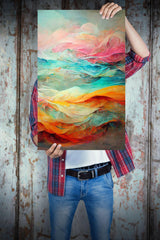 Person holding vibrant personalized canvas wall art with colorful abstract design.