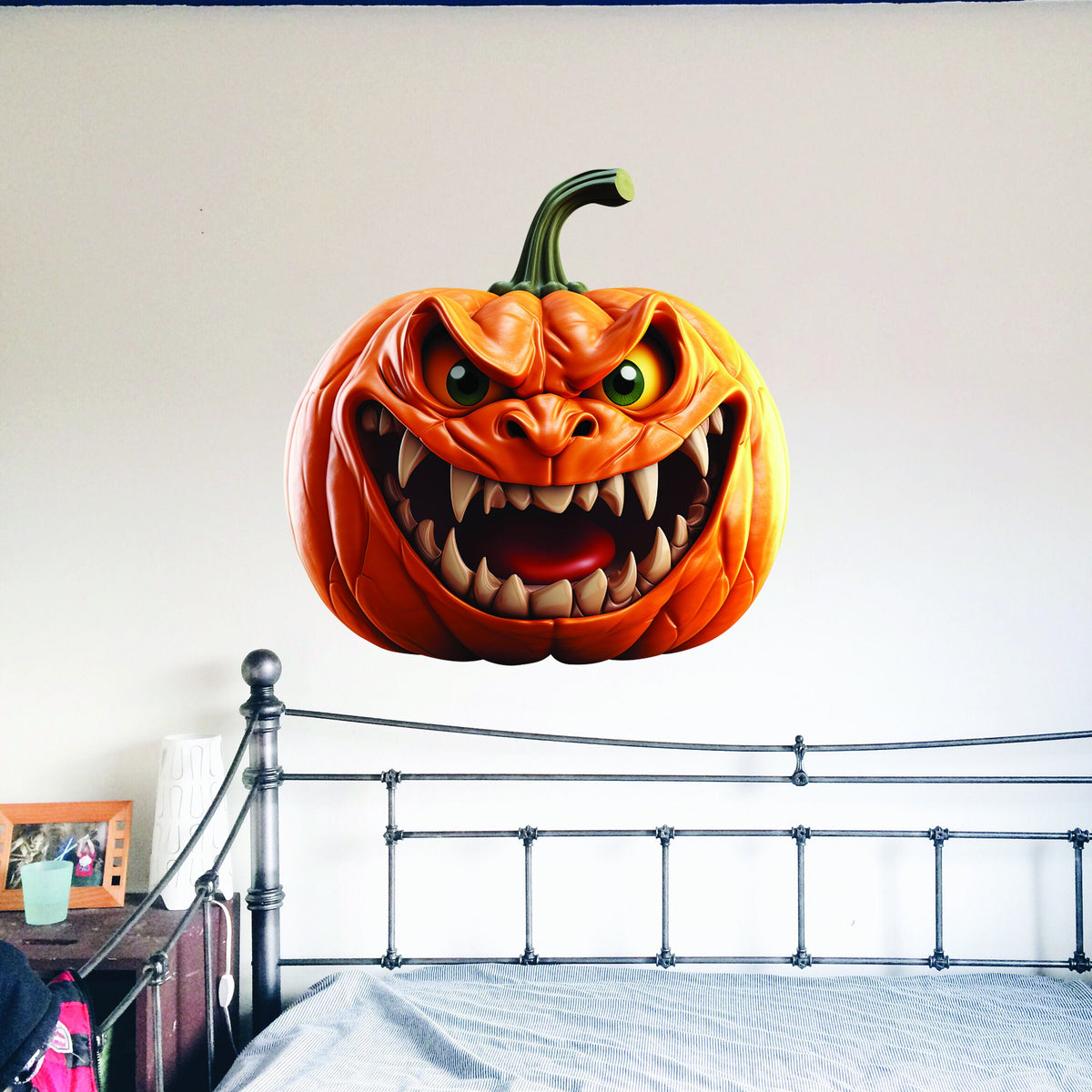 Orange pumpkin-face vinyl wall decal with a dimensional broken-wall visual effect.